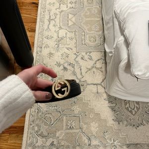 Black and gold Gucci belt